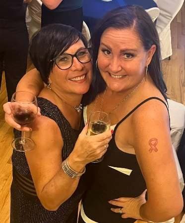 Two guests raising their glasses