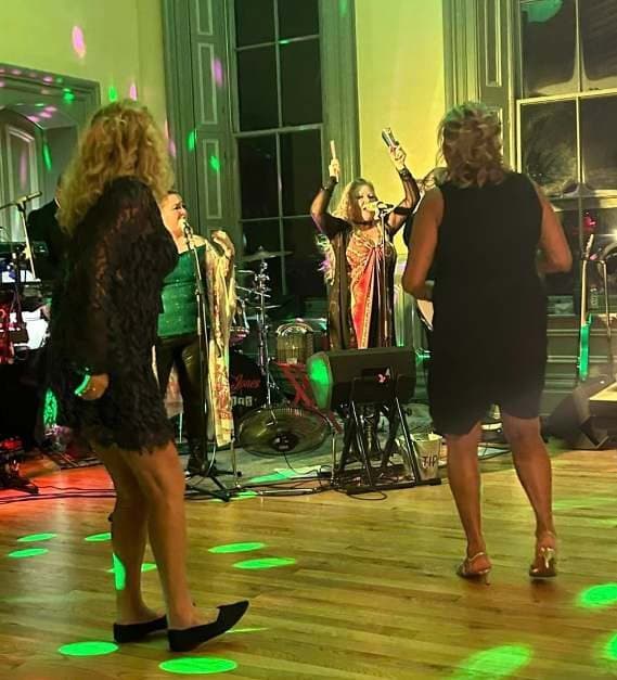 The band playing as guests dance