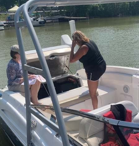 An inspector checking equipment aboard a member’s boat