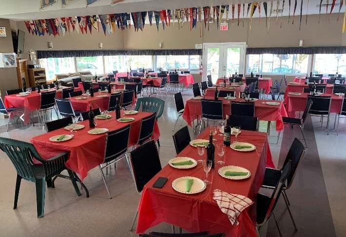 The clubhouse set up as a restaurant with red tablecloths