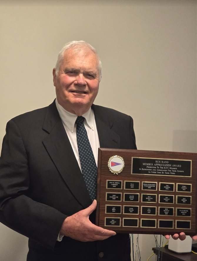 Bob Ashcroft holding the Rex Rand Award plaque