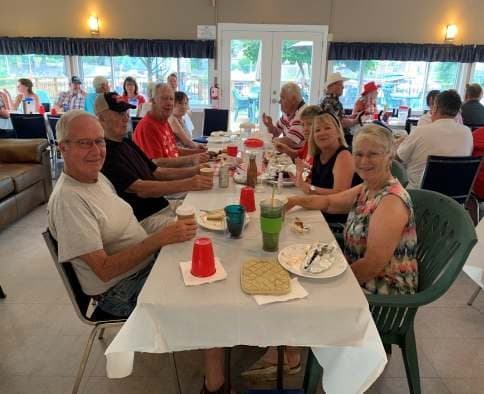 Members and guests at the long tables