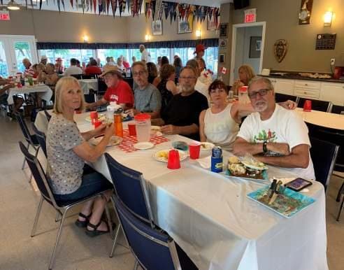 A table of friends enjoying the meal