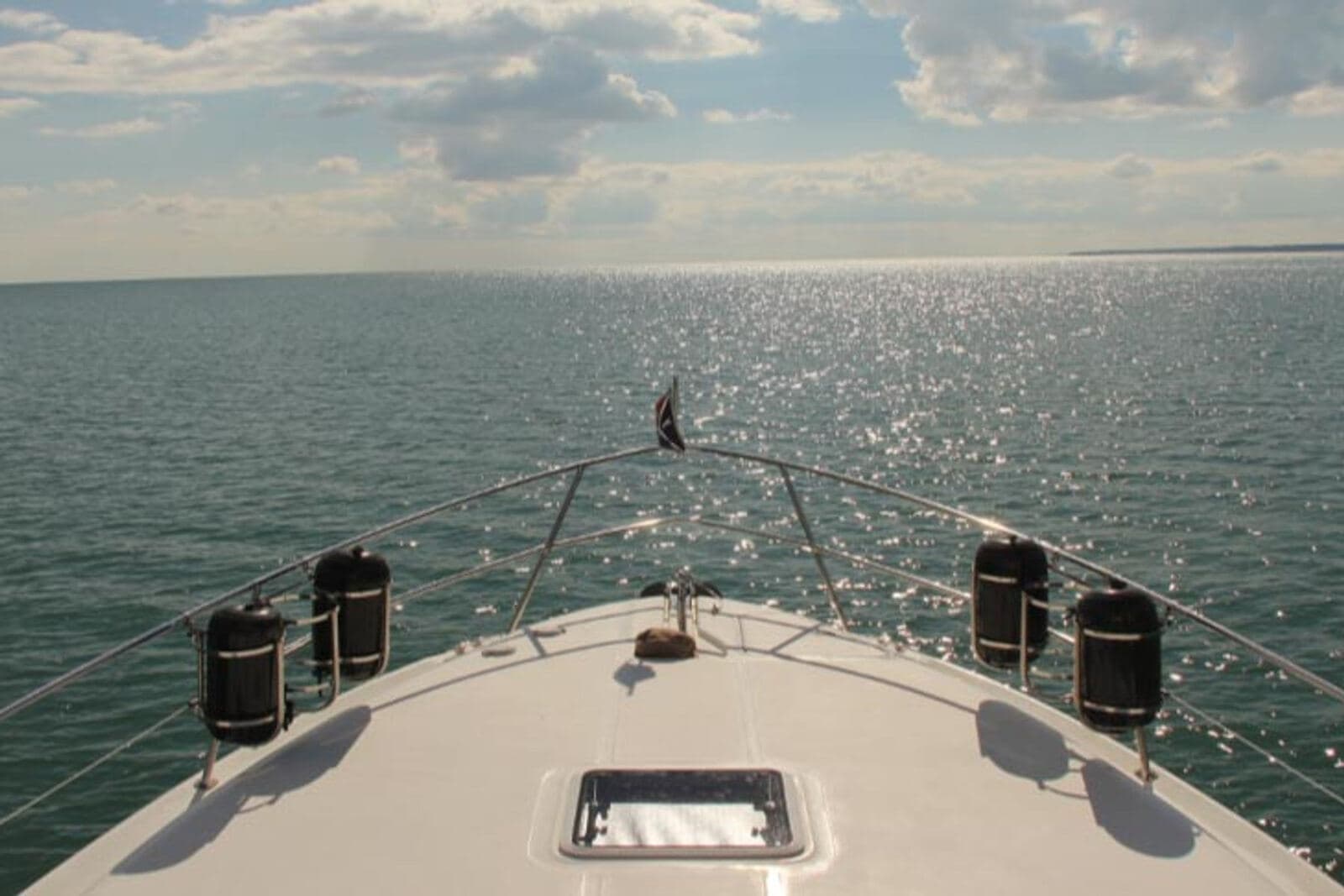 Looking over the bow of a member’s boat onto calm, open Lake Erie