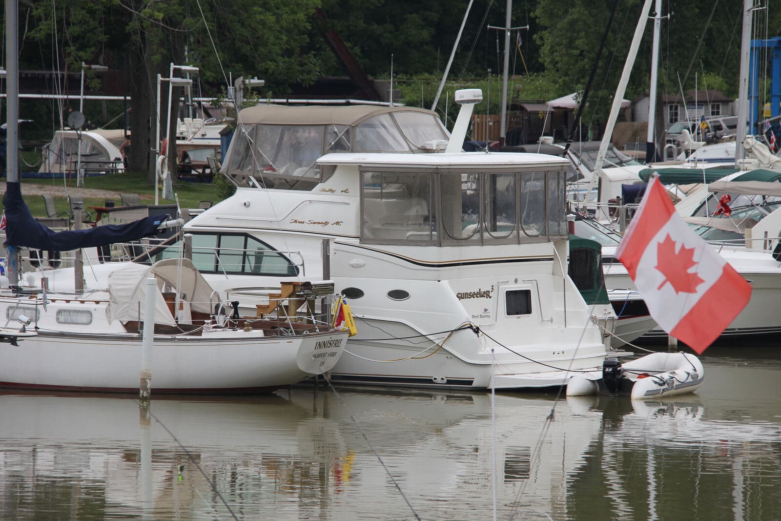 Boats at the club docks under a Canadian flag